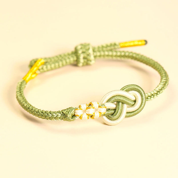 Pulsera de conexión de suerte con nudo de flor de melocotón, nudo de paz de ocho hilos hecho a mano con Buddha Stones