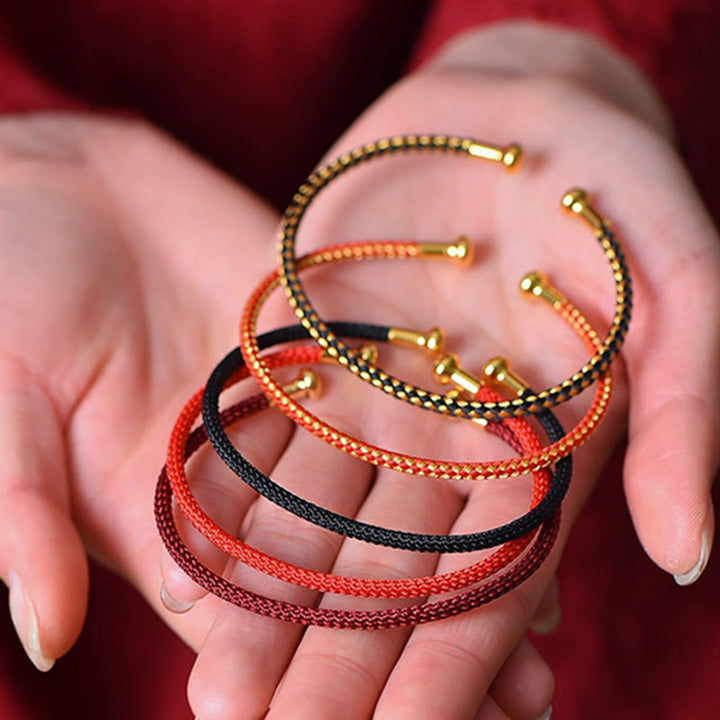 Pulsera de cuerda trenzada de la suerte hecha a mano con diseño simple de Buddha Stones - image 1