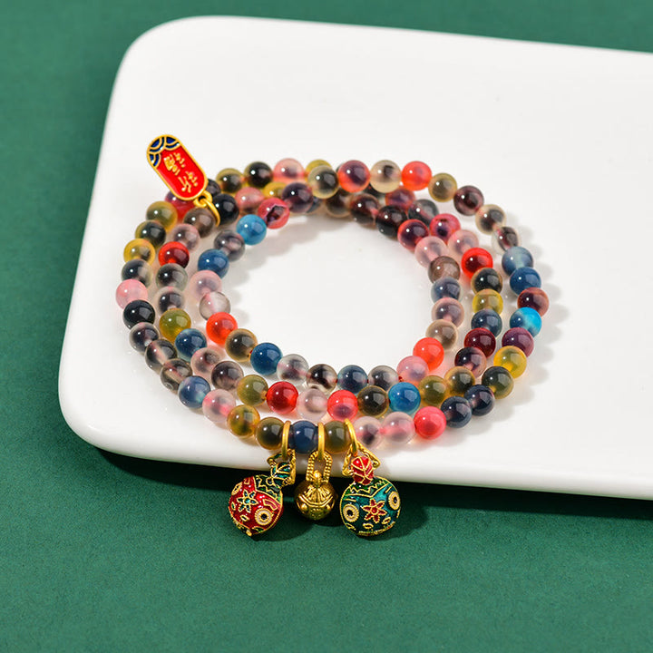 Pulsera de triple envoltura con dije de fuerza familiar de bestia tragadora de oro con ágata de caramelo colorida y Buddha Stones