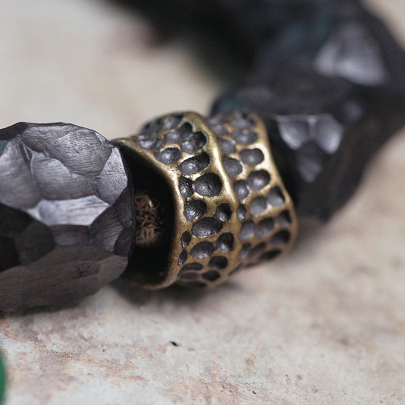 Pulsera Mala de muñeca con borla de paz de cobre y madera de ébano del Tíbet