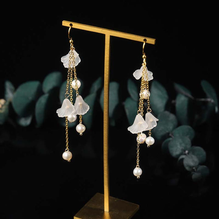 Pendientes colgantes de la suerte con pétalos de flores y perlas de Buddha Stones