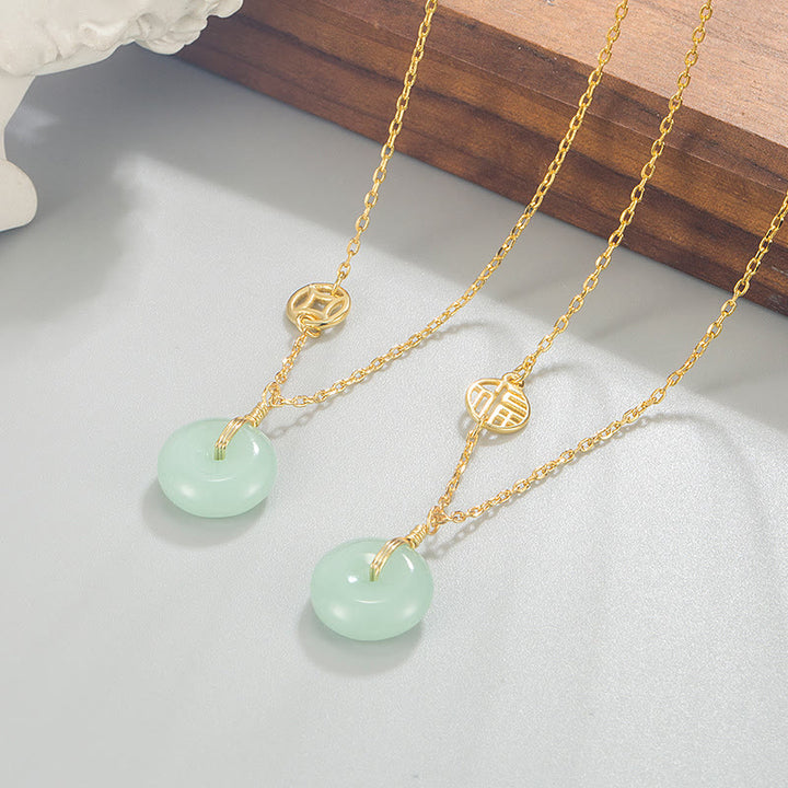 Collar con colgante de abundancia con hebilla de paz y moneda de cobre con carácter de Jade Fu de Buddha Stones