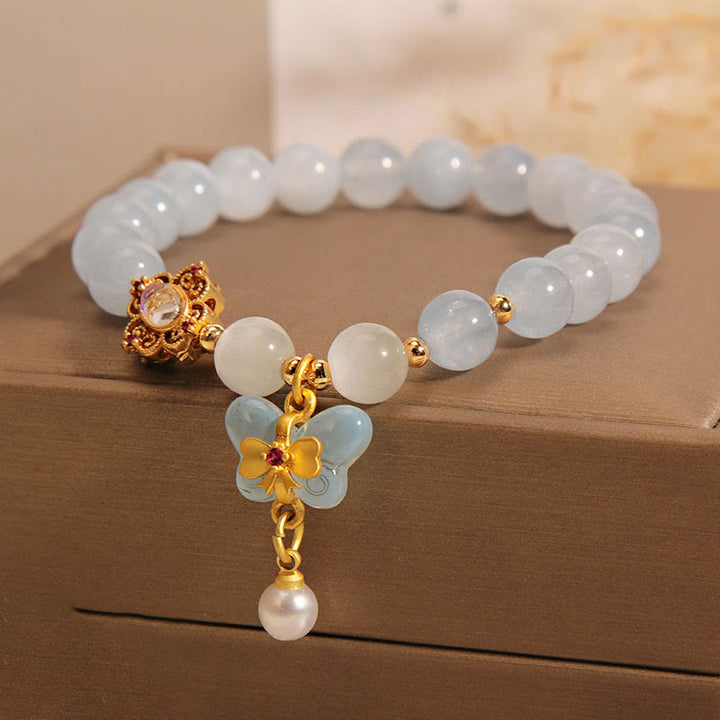 Pulsera con dije de perlas y mariposas curativas con ojo de gato, aguamarina y Buddha Stones
