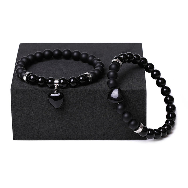 Buddha Stones 2 piezas de piedra de cristal de ónix negro amor protección del corazón pulsera de pareja