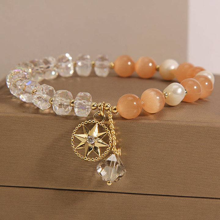 Pulsera de soporte con estrella de cristal blanco y ojo de gato naranja de Buddha Stones