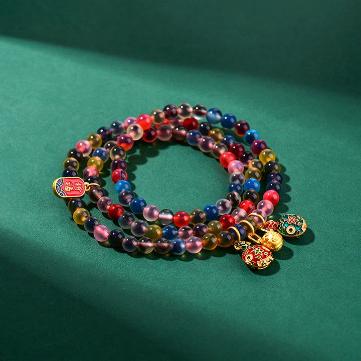 Pulsera de triple envoltura con dije de fuerza familiar de bestia tragadora de oro con ágata de caramelo colorida y Buddha Stones