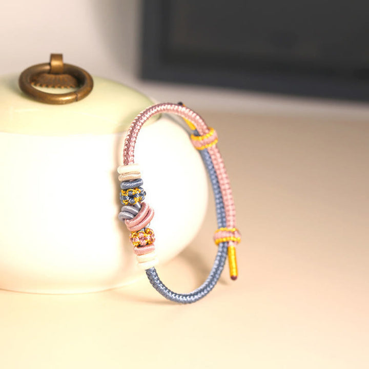 Pulsera de conexión de suerte con nudo de paz de ocho hilos hecha a mano con cuerda de dos colores con Buddha Stones