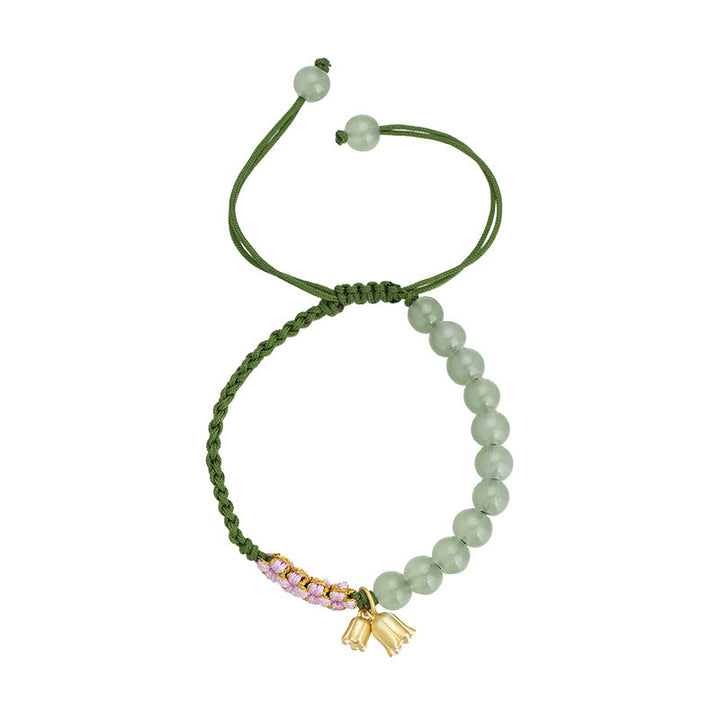 Pulsera trenzada de la suerte con dije de lirio de los valles y cuentas de jade hechas a mano con Buddha Stones