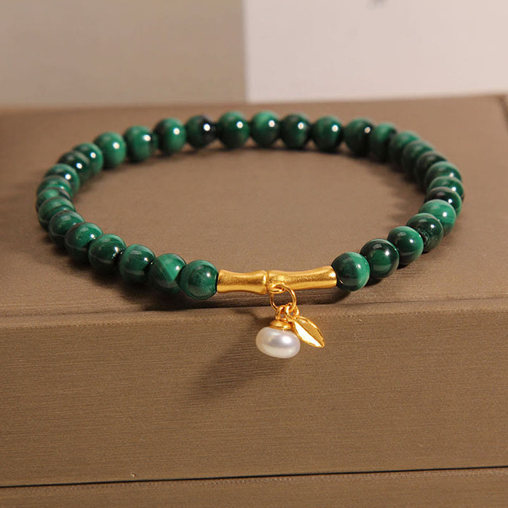 Pulsera antiansiedad de bambú de la suerte con perlas de malaquita natural de Buddha Stones