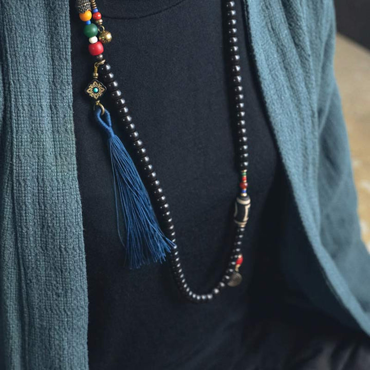 Buddha Stones 108 cuentas Mala madera de ébano cuentas Dzi cobre equilibrio borla pulsera