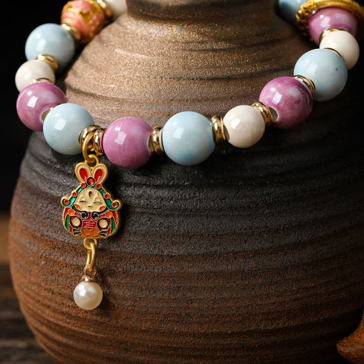 Buddha Stones tibetano Zakiram diosa de la riqueza conejo cabeza de león encanto Liuli vidrio incienso ceniza porcelana cuentas pulsera de protección