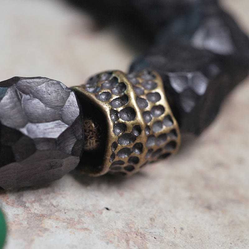 Pulsera Mala de muñeca con borla de paz de cobre y madera de ébano del Tíbet