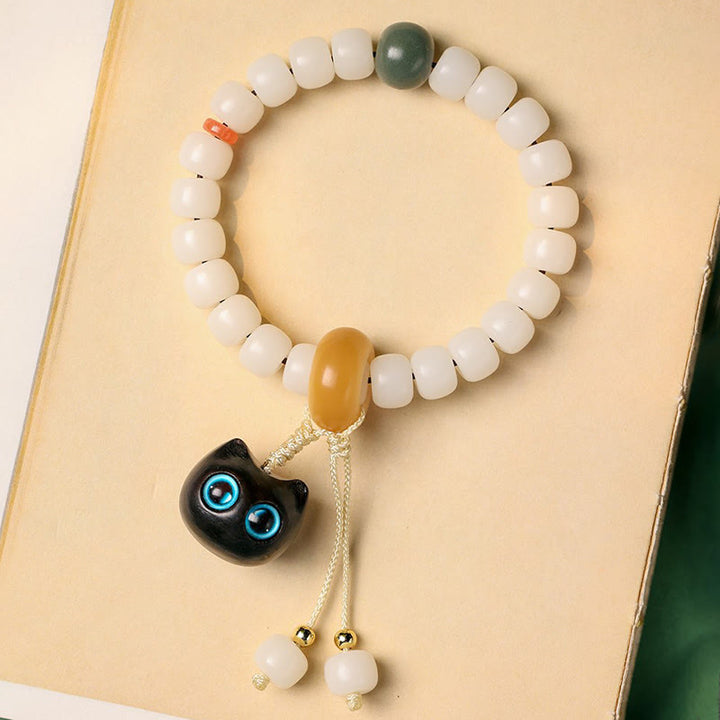 Pulsera de armonía de paz con dije de gato encantador de madera negra africana con semillas de Bodhi naturales de Buddha Stones - image 7