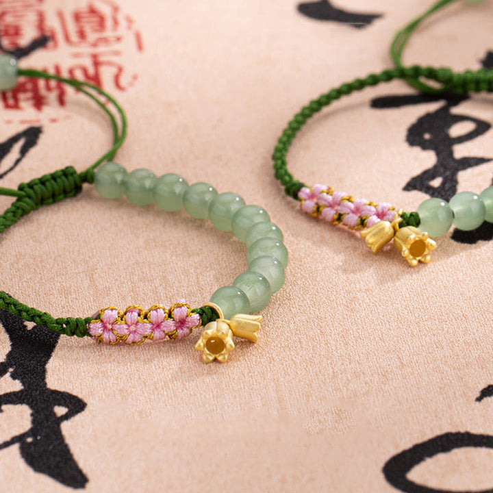 Pulsera trenzada de la suerte con dije de lirio de los valles y cuentas de jade hechas a mano con Buddha Stones