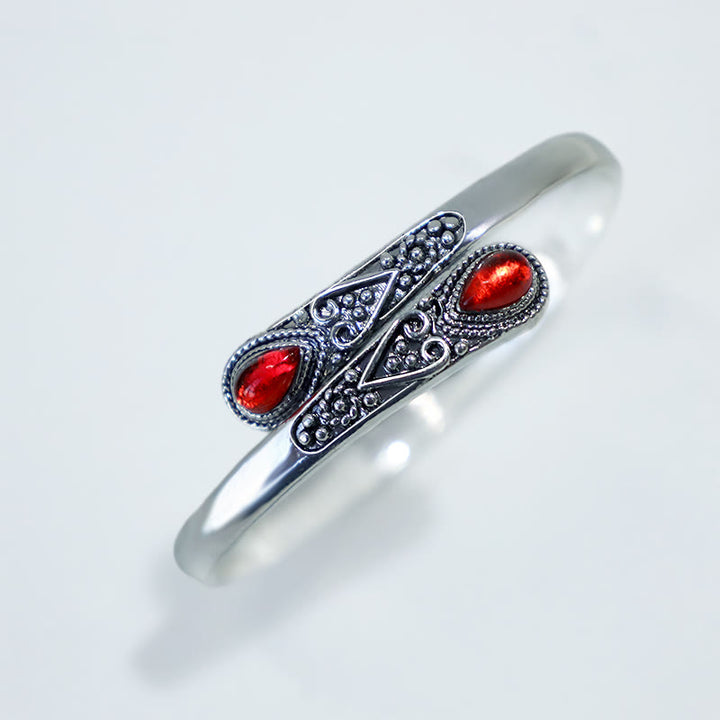 Brazalete de pulsera curativo con patrón de gota de agua de circonita con Buddha Stones