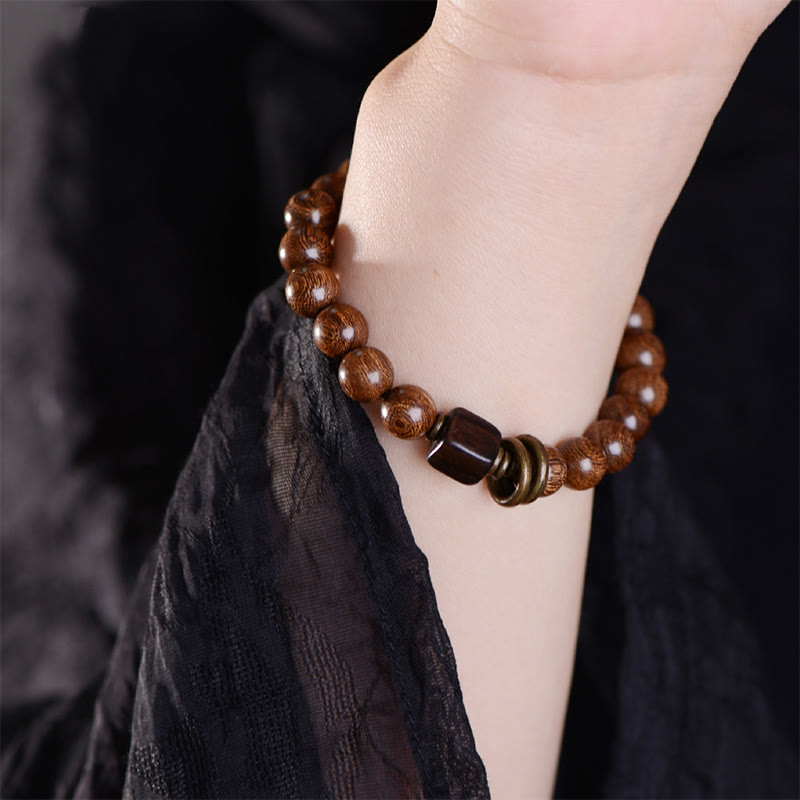 Pulsera de espiritualidad de madera de Phoebe Zhennan con Buddha Stones