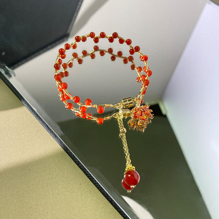 Pulsera con amuleto de la suerte de hoja de arce roja con Buddha Stones